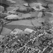Denny, general view, showing Glasgow Road and Herbertshire Street.  Oblique aerial photograph taken facing north-east.