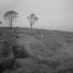 Cairnpapple Hill,  photograph of excavation showing henge ditch from ESE.