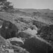 Cairnpapple Hill, photograph of excavation showing kerb stones of Period III cairn on W.