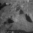 Cairnpapple Hill, photograph of excavation showing stone-hole 7, Inhumation grave 3.