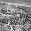 John Fleming and Co. Ltd. Timber Yard and East St Clement's Church, St Clement Street, Aberdeen.  Oblique aerial photograph taken facing north-east.  This image has been produced from a crop marked negative.