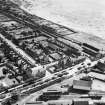 Carnoustie, general view, showing Station Hotel, Station Road and Tayside Street.  Oblique aerial photograph taken facing south-east.  This image has been produced from a crop marked negative.