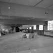 Interior view of the first floor of the South block of C&J Brown's warehouse seen from the South.