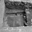 Excavation photograph : area N - posthole 978, in mixed mortar and clay 976, and slot 982 cutting 989.