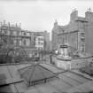 East elevation, showing part of Calton Hill Burial Ground and old Tenement at 15 Calton Hill, Edinburgh.