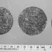 Silver coins from the wreck-site. (L-R: obverse of Philip IV ducaton, Brabant mint; obverse of United Provinces ducaton dated 1670; obverse of United Provinces 1-guilder coin dated 1706.)