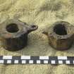 Bronze bushes or coaks. These were normally used as bearings in the wooden  sheaves of pulley blocks, but their find beneath the swivel-gun suggests that they may have been used in conjunction with its mounting. Scale in centimetres and inches.