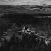 Glamis Castle and Estate.  Oblique aerial photograph taken facing west.  This image has been produced from a print.