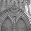 Detail. Entrance door spandrel with female saint