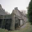 View of gates and cottage wing from N