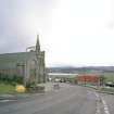 View from N showing setting looking over the Kyle of Sutherland