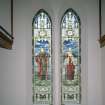 Interior. E wall detail of stained glass windows depicting Faith and Love 1923