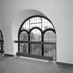 Interior, detail of arched window at gallery level