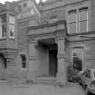 Detail of W entrance porch and 1890 date stone