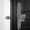 Interior. Detail of drawing room door metalwork