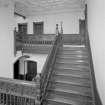 Interior. View of staircase half-landing from N