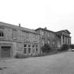 View from WSW showing original school and later buildings