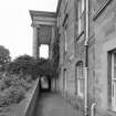 View of S basement area from E showing arched passage under portico