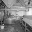 Mash House. Interior view showing (left to right) emergency douche and eye bath, mash conversion vessel (centre), and Meura 2001 mash filter (right)
