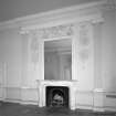 First floor drawing room detail of fireplace, giant order Ionic pilasters and plaster cartouches.