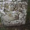 View of 17th-century headstone, with skull and possible bakers symbols, Logie Old Churchyard.
