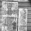 Photographic copy of three rubbings. The upper rubbing shows the lower right panel detail, and the right rubbing shows the lower left panel of face of Meigle no. 1 Pictish cross slab, now in Meigle Museum. The left rubbing shows detail of face of Dyce no.2 Pictish cross slab, Chapel Of St Fergus, Dyce. 
