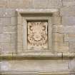 Detail of armorial panel above W entrance
