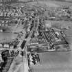 Denny, general view, showing Cruikshank and Co, Ltd, Denny Iron Works, Glasgow Road and Paris Avenue,   Mydub, Denny, Stirlingshire, Scotland, 1950. Oblique aerial photograph taken facing north.  This image has been produced from a crop marked negative.