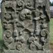View of headstone 1736 with skull, crossbones and rabbits in floral surround, Tarbolton Parish Churchyard.