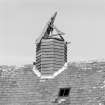 Detail of round wooden revolving ventilator on roof of kiln.