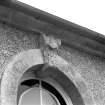 Detail of SE elevation window keystone with decorative head.
