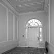 Interior. Entrance hall showing tile floor, plasterwork and fanlight