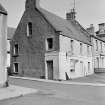 View of 28 Newtown Street, Duns showing the premises of J & M Anderson and the corner to Gourlays Wynd from south west.