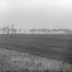 Photograph recording the site of Granton Gasworks, Edinburgh, prior to construction, looking NE from the SW corner of the site.