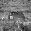 Excavation photograph : view of relationship of boundary wall 502 over 101, looking north.