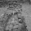 Excavation photograph : sondage to west of ruins with top of cut in natural rock, looking west.