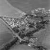 Oblique aerial view of the village of Kilrenny centred on the church, taken from the E.