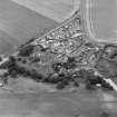 Oblique aerial view of the village of Kilrenny centred on the church, taken from the NNE.