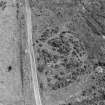Oblique aerial view centred on the remains of cairn and stone circle, Moss Farm Road, Arran.
