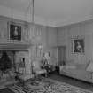 Interior view of Lickleyhead Castle showing the drawing room with fireplace.