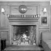 Interior view of Cessnock Castle showing fireplace in baronial hall.