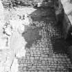 Craignethan Castle
Excavations 1984
Frame 9 - The floor of the basement, showing cobbles and other (partially excavated) features - from west
