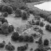 Oblique aerial view centred on Lochmaben Castle from NE, showing excavations in progress.