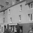 View of 34-35 Shore Street, Anstruther Easter, from S, showing the premises of J. Smith Newsagent and Stationer.