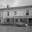 View of 20-24 Glasgow Street, Ardrossan, from NW, showing the Derby Cafe and The Bute Bar.