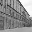 General view from S of facade of tobacco warehouse.