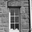 View of window in Grudie Bridge Power Station with carving of 'Pictish beast' in Pictish-style.
 
