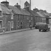 General view of buildings on the north side of Drummond Street, Muthill, including Dilwara.