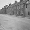General view of buildings on the north side of Drummond Street, Muthill,