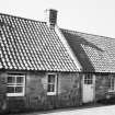 View of outbuildings from E.